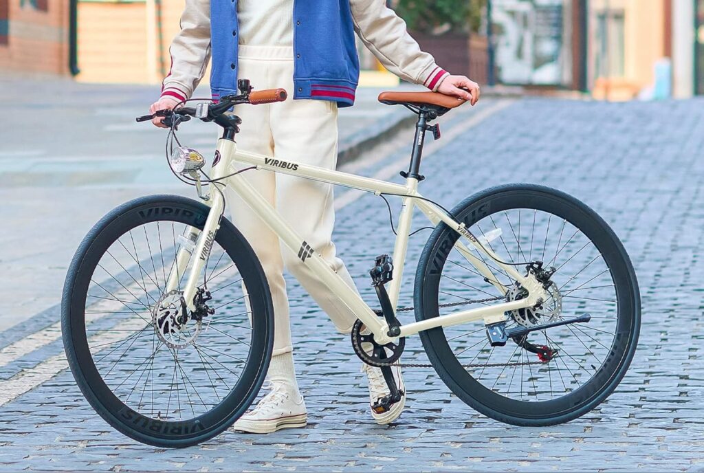 Cyclist riding one of the best bikes for commuting through busy suburban street during morning rush hour