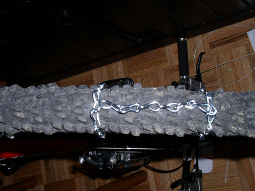 Once the chain links are in place, route the cable through the end links and secure with cable ferrule.