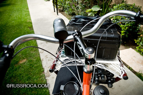 Bilenky cargo bike with front platform loaded with Pelican case and photography equipment showing the boom tube, front rack, and overall geometry