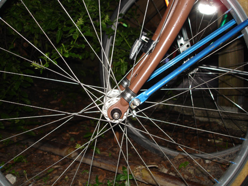 Here’s a pair of larger-diameter clamps pressed into service on the fork blades…allowing me to mount a full-coverage fender to the bike.