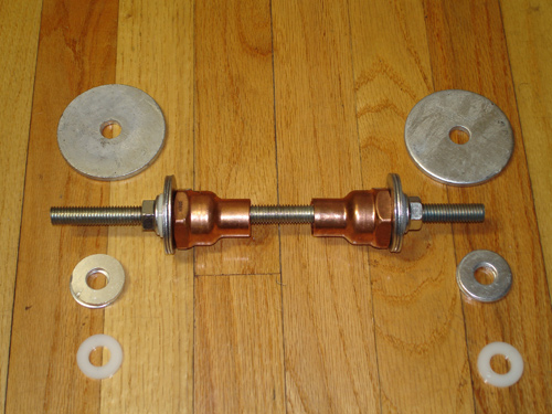  Large washers, a piece of 3/8″ threaded rod (sometimes referred to as "allthread") & a pair of flange nuts. 