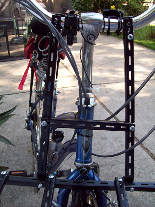 Measure and cut the other end for the conduit hangers. I did not have any shelf rod extend above the handlebar. This is contrary to any of these types of racks I’ve seen.