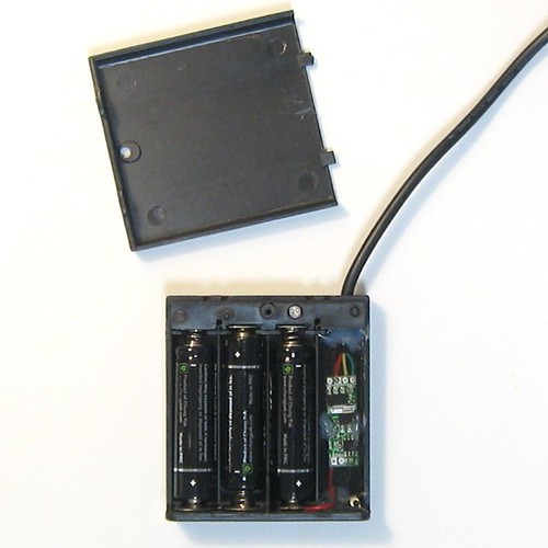 Backpack Bike Light battery compartment showing AA batteries and wiring for LED system power.