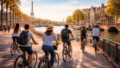Best cycling cities for bike commuting and bike tours showing cyclists riding on a protected urban bike lane with modern city skyline in the background