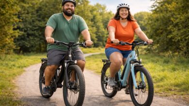 Happy couple enjoying best electric bikes for heavy riders on sunny park path